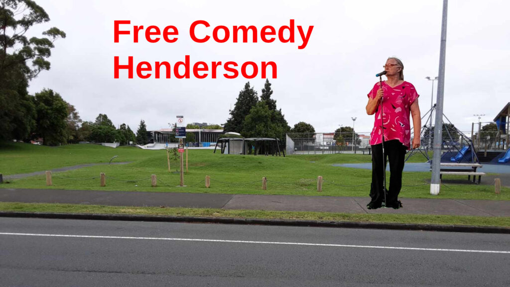 A comedian outside a grassy park