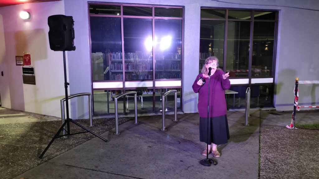 Tessa performs outside the Pt Chev Library